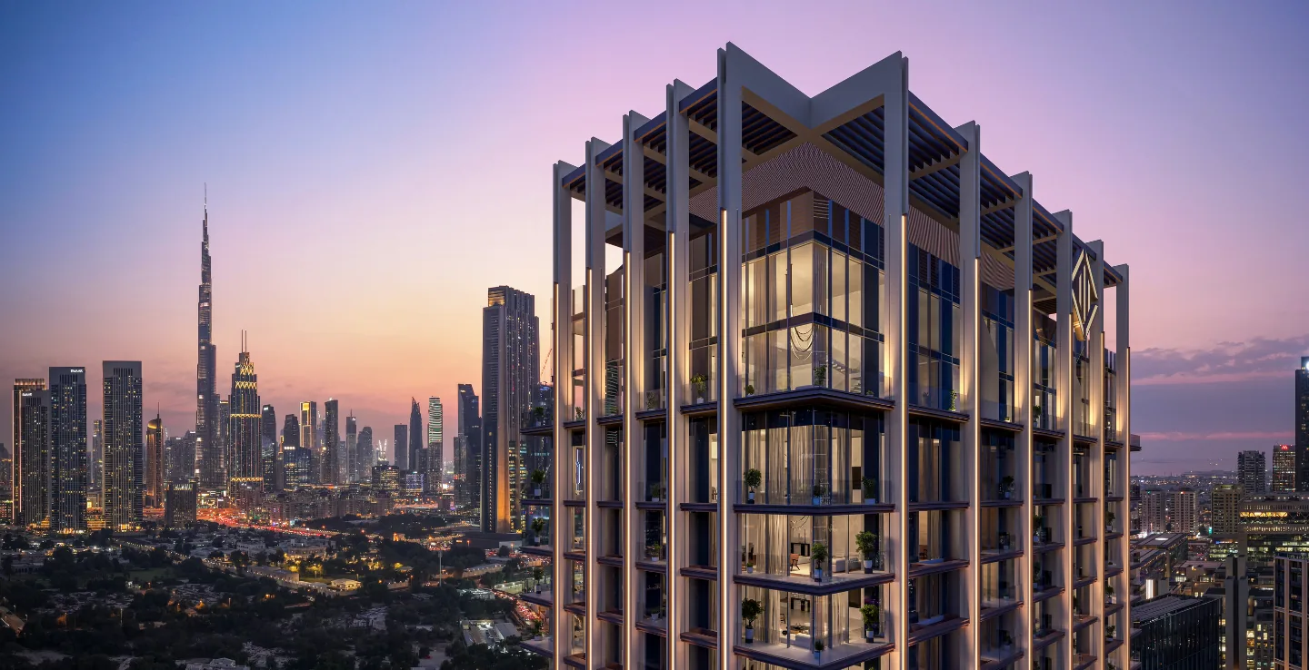 The Residences DIFC tower at sunset with the Downtown Dubai skyline
