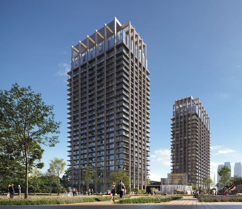 The Residences DIFC towers rising above the green public realm