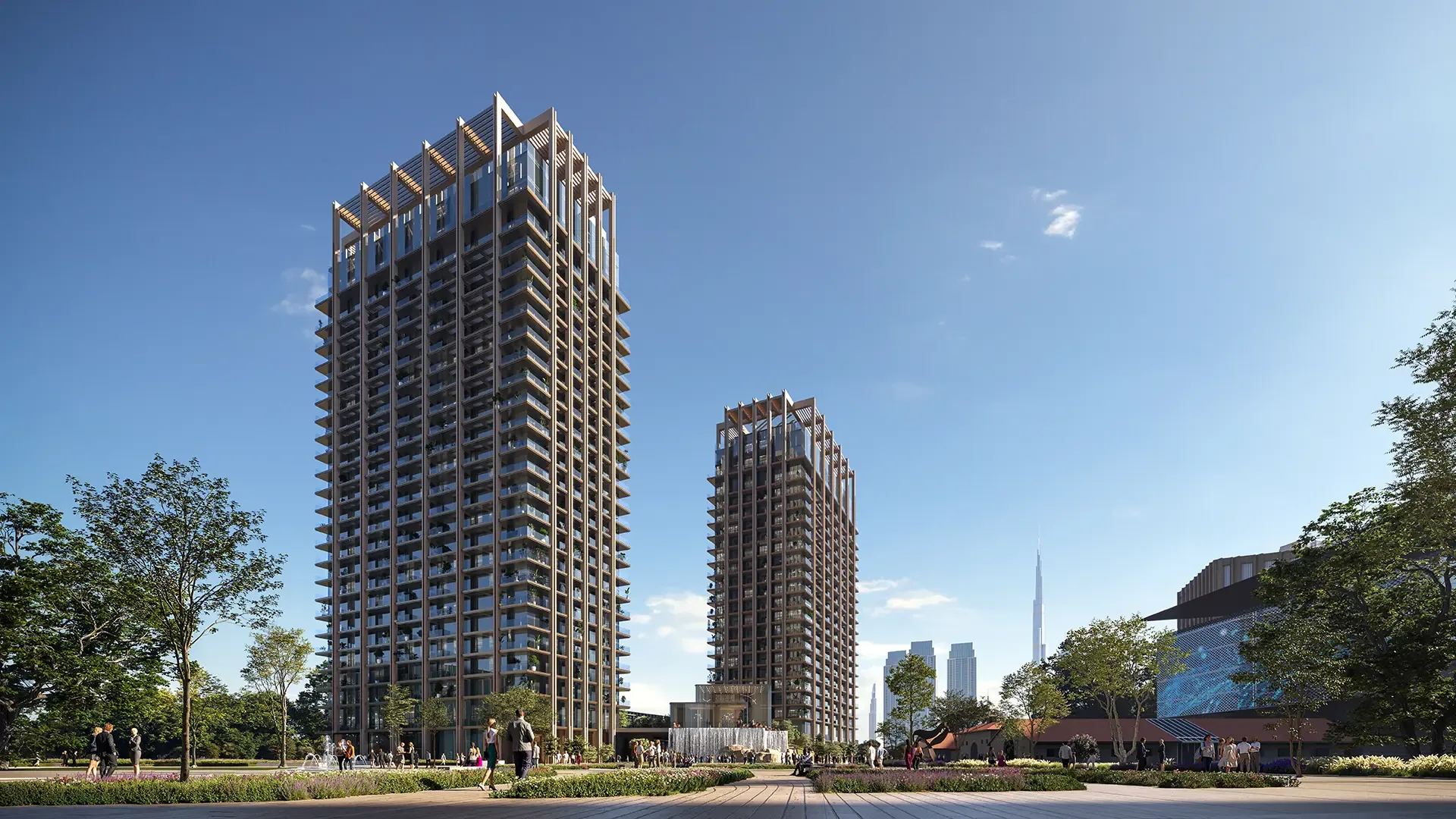 The two residential towers of The Residences DIFC framed by landscaped parkland